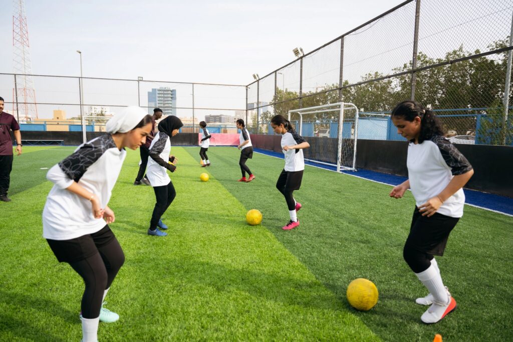 Focused Saudi sportswomen practicing their footwork