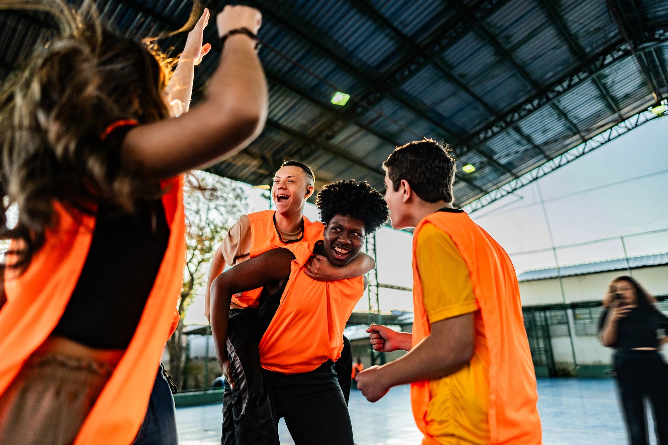 Student team celebrating on sports field